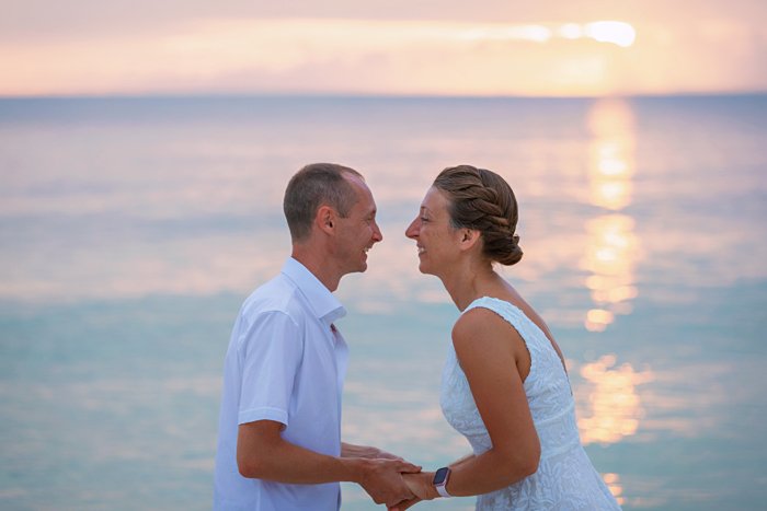 couple looking at each other with sunset