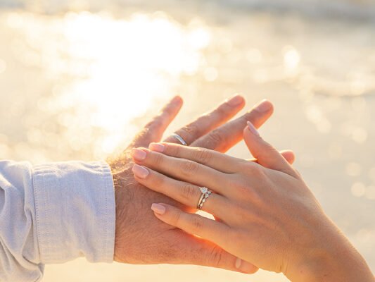 elopement couple look at their wedding rings