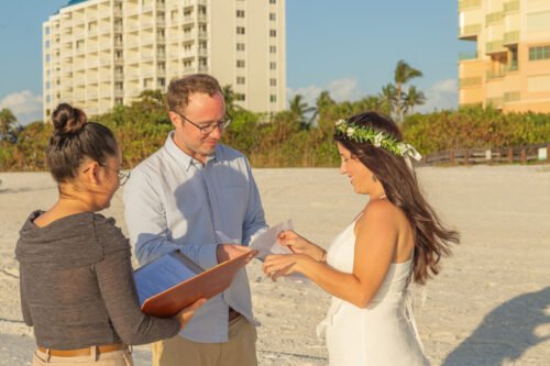 exchanging rings during elopement ceremony on Marco Island beach