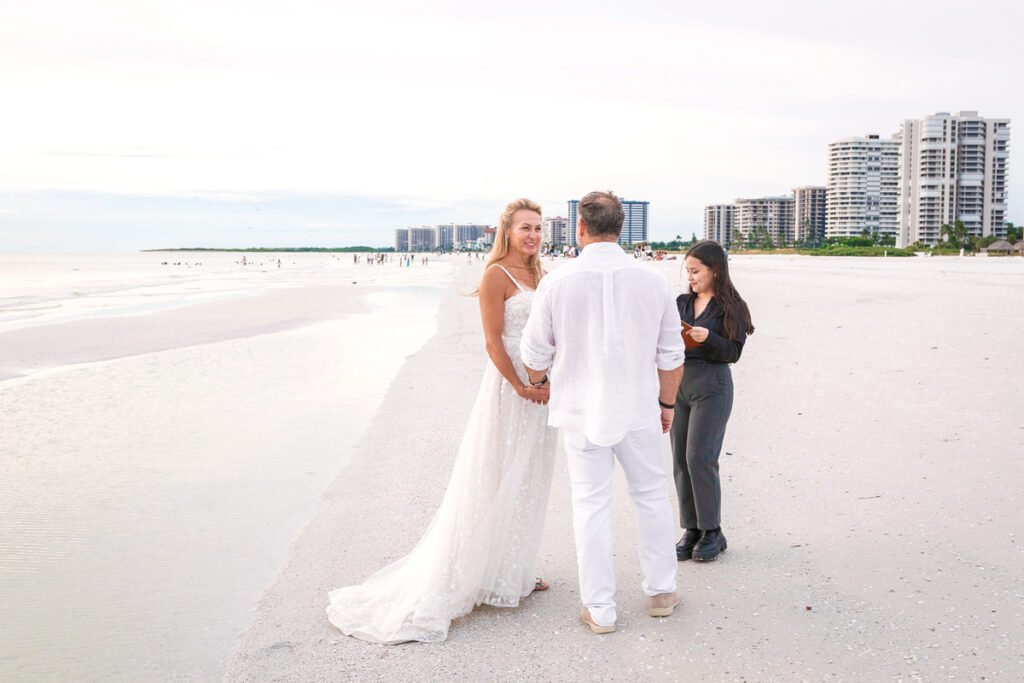 beach ceremony with officiant and couple
