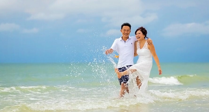 couple enjoy beach after Naples elopement
