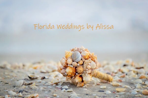 wedding bouquet of seashells on beach